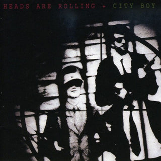 the album cover for City Boy - Heads Are Rolling