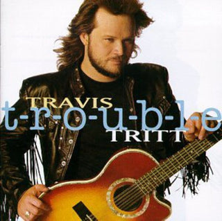 the album cover for Travis Tritt - T-R-O-U-B-L-E