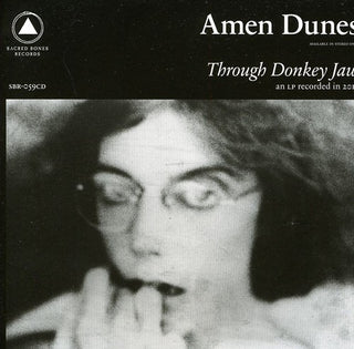 the album cover for Amen Dunes - Through Donkey Jaw