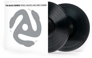 the album cover for Black The Crowes - Three Snakes & One Charm