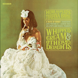 the album cover for Herb Alpert - Whipped Cream & Other Delights