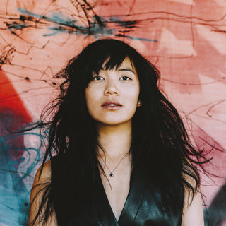 the album cover for Thao & The Get Down Stay Down - A Man Alive