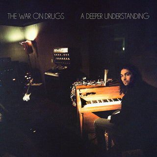 the album cover for The War On Drugs - Deeper Understanding