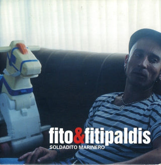 the album cover for Fito y Fitipaldis - Lo Mas Lejos A Tu Lado + Soldadito Marinero (CD+7-inch Vinyl)