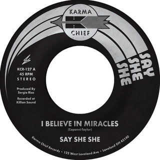 the album cover for Say She She - I Believe In Miracles / C'est Si Bon