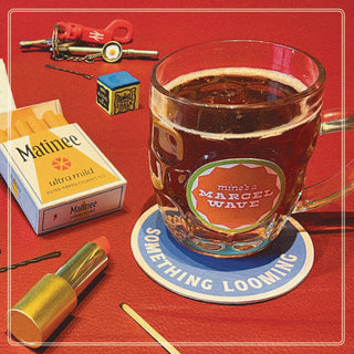 the album cover for Marcel Wave - Something Looming