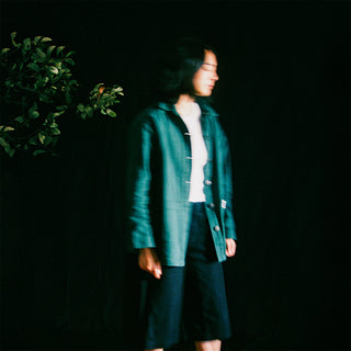 the album cover for Mini Trees - Slow It Down