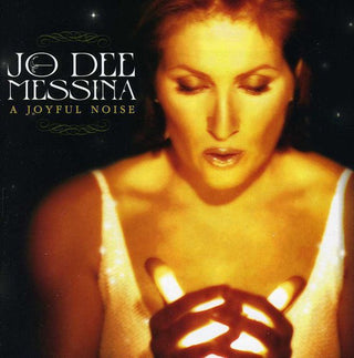 the album cover for Jo Dee Messina - A Joyful Noise