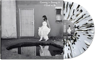 the album cover for Crossing I's Dotting T's - I Used To Be [BLACK/WHITE/CLEAR SPLATTER]